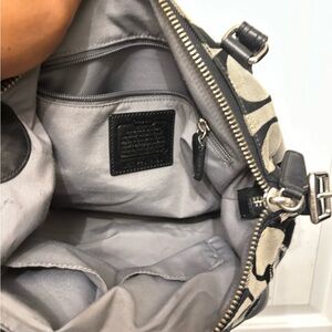 Very nice coach purse , with a little small call out on the front .